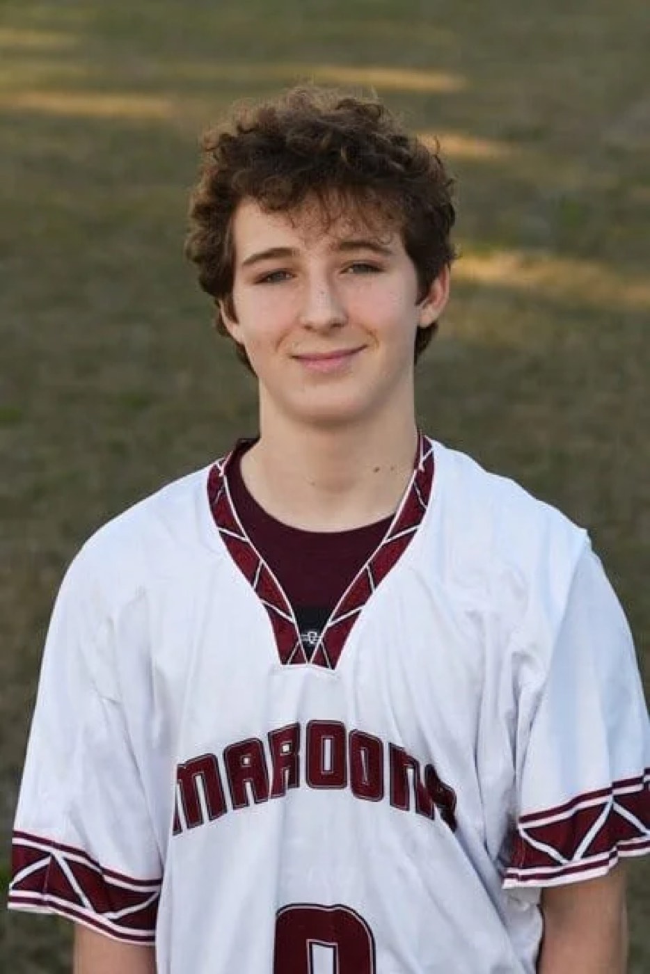 Portrait of Bond Temple in a Maroons lacrosse jersey.