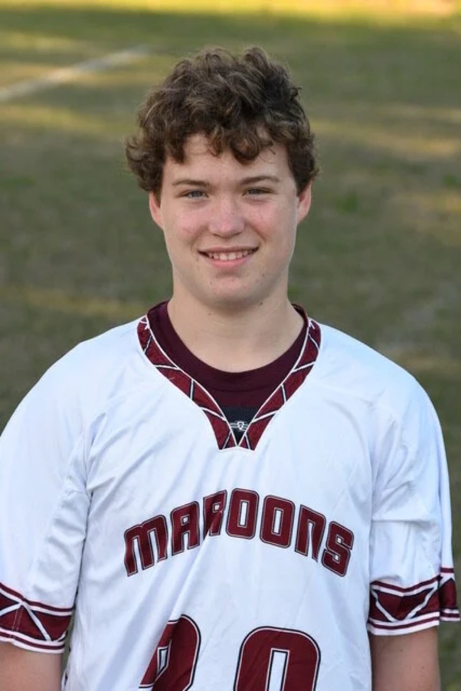 Portrait of Whit Teeple in a Maroons lacrosse jersey.